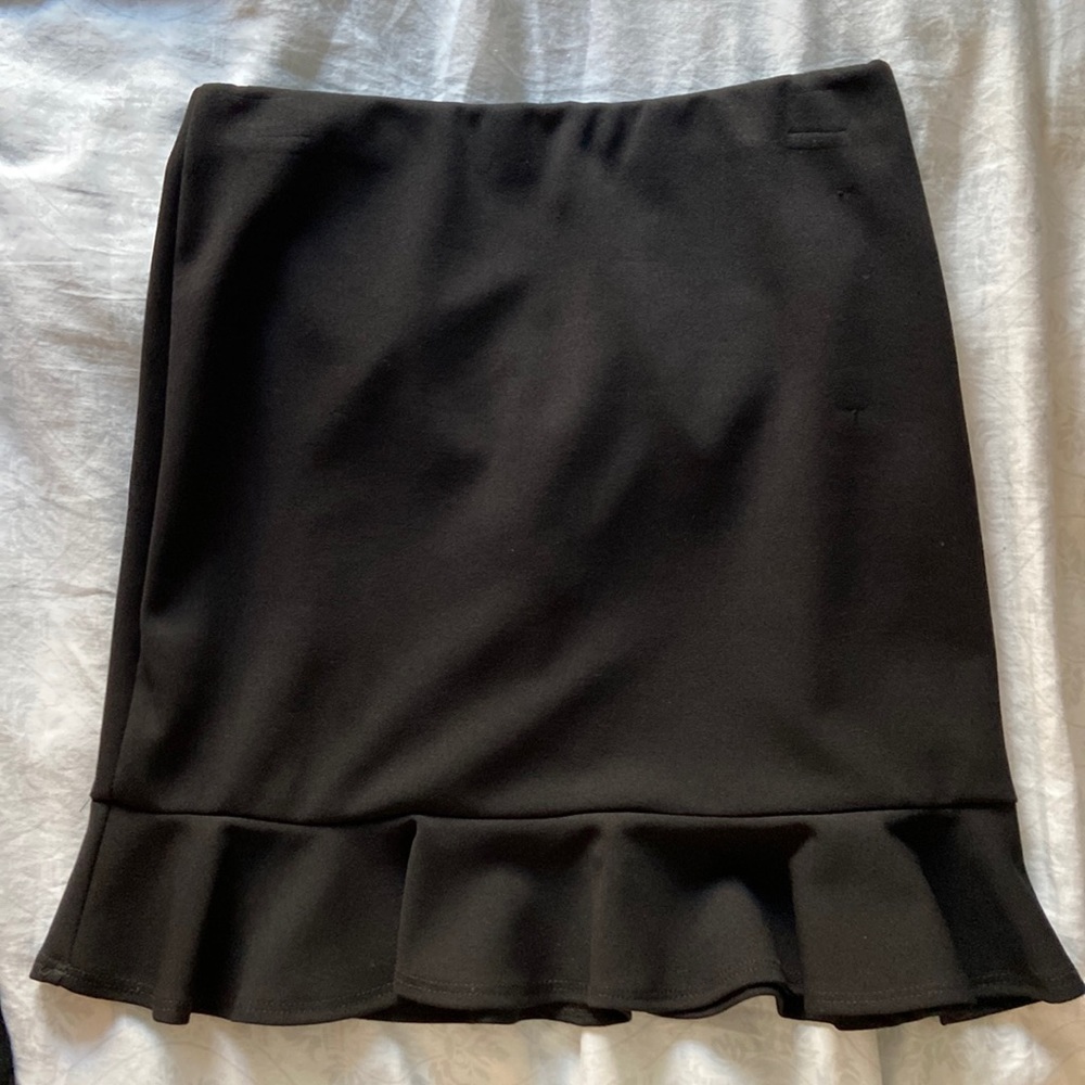 Like new Black mini skirt with ruffle detail from Bloomingdale’s
